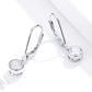 Pair of round zircon drop hoop earrings in polished sterling silver