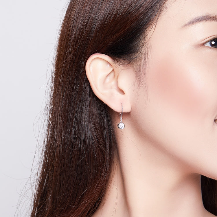 Model wearing sterling silver round zircon drop earrings with lever hooks