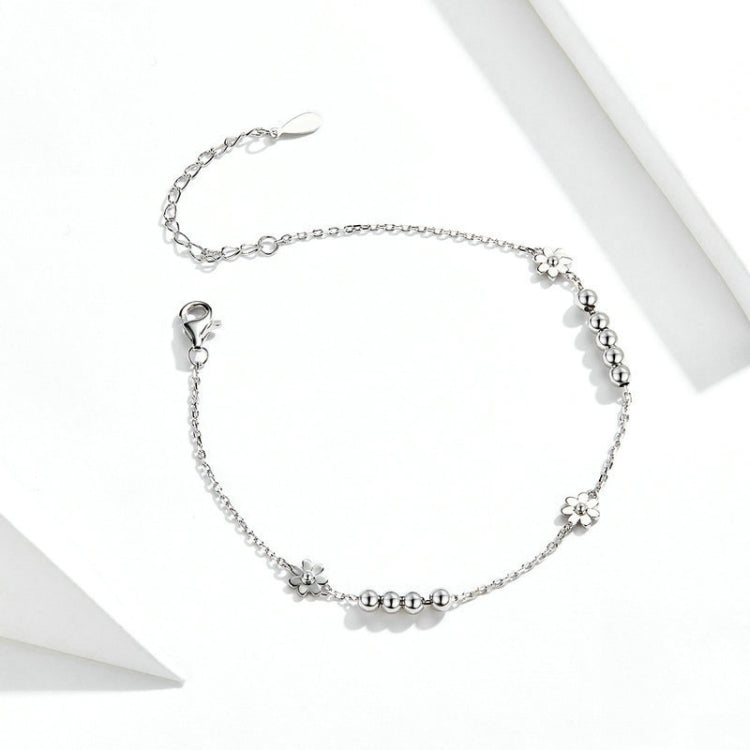 Sterling silver daisy bracelet with small flower charms and beaded chain links