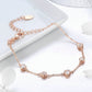 Rose gold plated zircon bracelet with round and heart crystal charms, toggle clasp