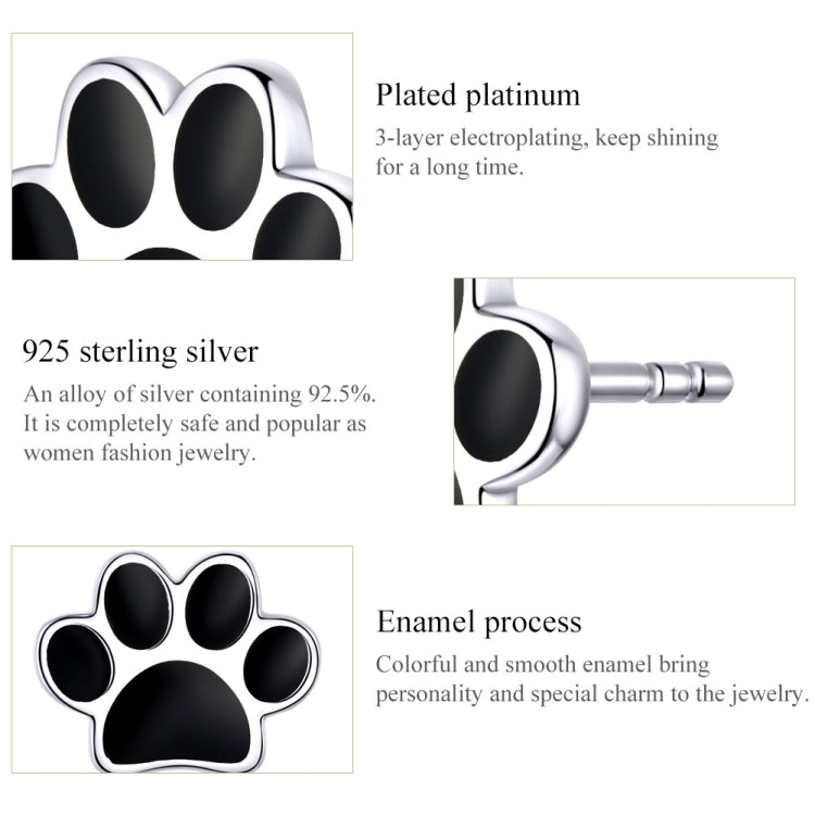 Sterling silver paw print stud earrings with glossy black enamel and polished silver frame