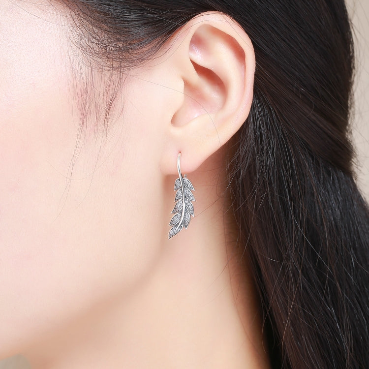 Silver leaf dangle earrings with diamond-cut details