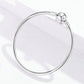 Sterling silver star bead bracelet shown from above with round star charm