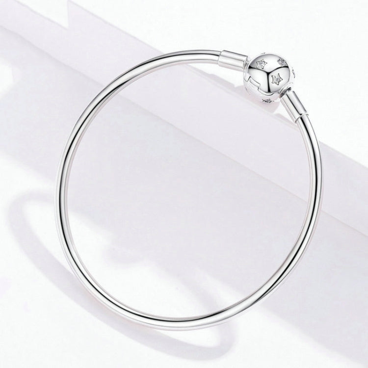 Sterling silver star bead bracelet shown from above with round star charm