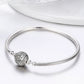 Sterling silver charm bangle with round pave bead detail and linked connectors