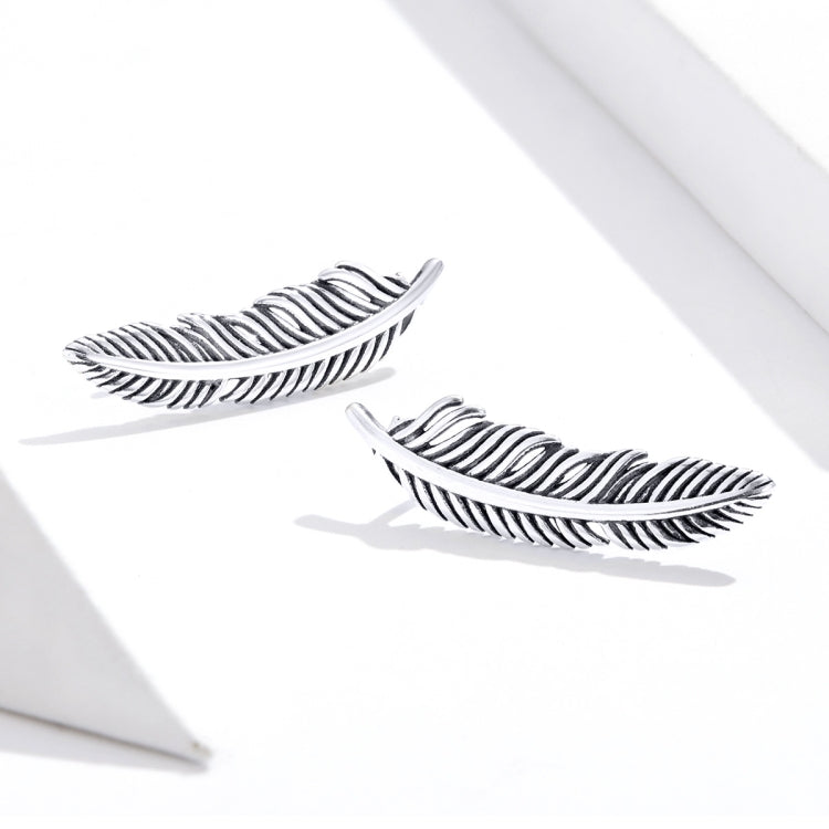 Sterling silver ribbed feather drop earrings with hook backs, pair