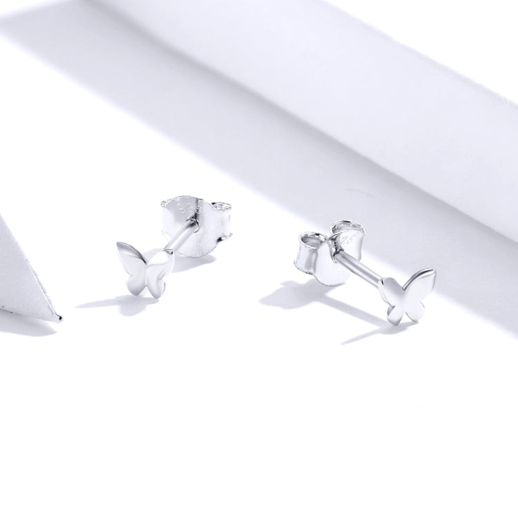 Butterfly stud earrings angled view with silver-toned butterfly charms on posts