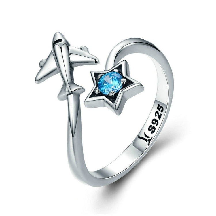 Sterling silver open ring with star accents and blue center gem, S925 marked band