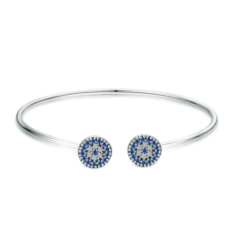 Sterling silver bangle bracelet with two round blue zircon inlaid charms