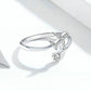 Open silver ring featuring airplane zircon motif with small round stones on top