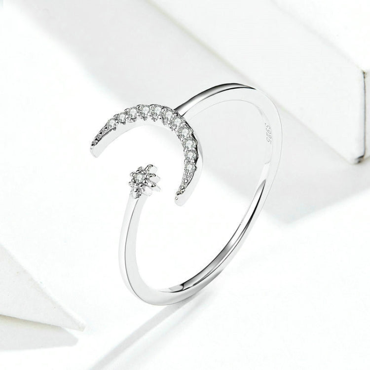 Sterling silver open crescent zircon ring with small flower-like charm detail