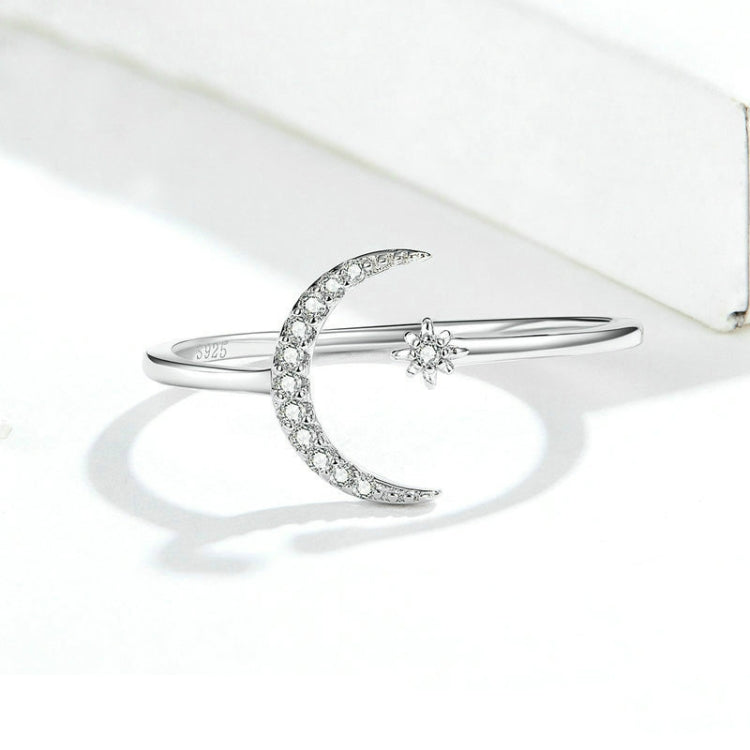 Sterling silver open crescent zircon ring with flower-stone charm on band