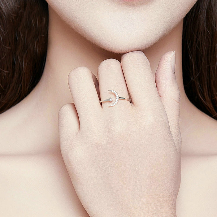 Sterling silver crescent zircon open ring on finger, small flower charm