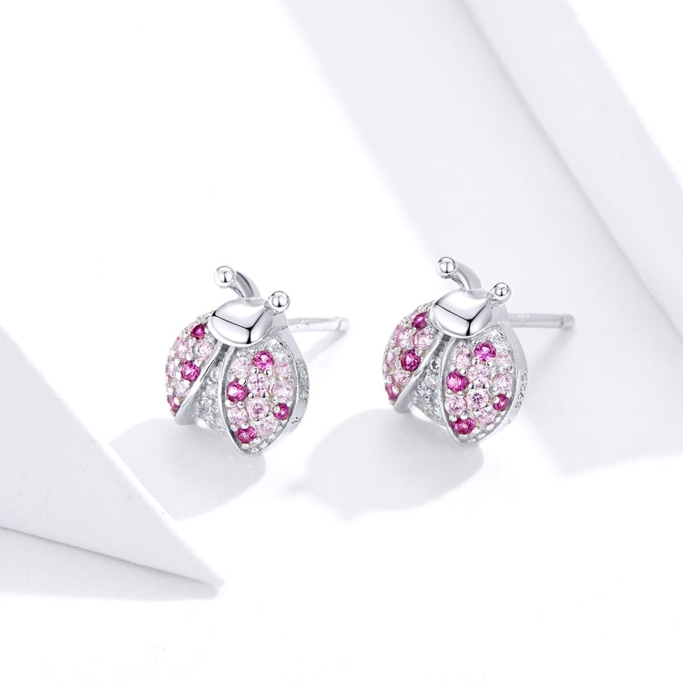 Sterling silver ladybug stud earrings with pink stones