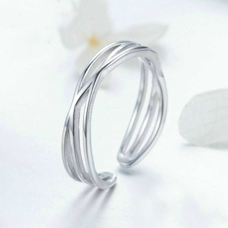 Silver open ring with smooth triple stacked bands and glossy reflective surface