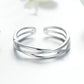 Silver open triple-band ring with polished, reflective metal from front view