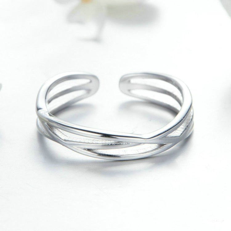 Silver open triple-band ring with polished, reflective metal from front view