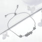 Sterling silver bracelet with dangling flower charms and round bead clasp ends