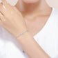 Sterling silver daisy bracelet with flower charms on a wrist