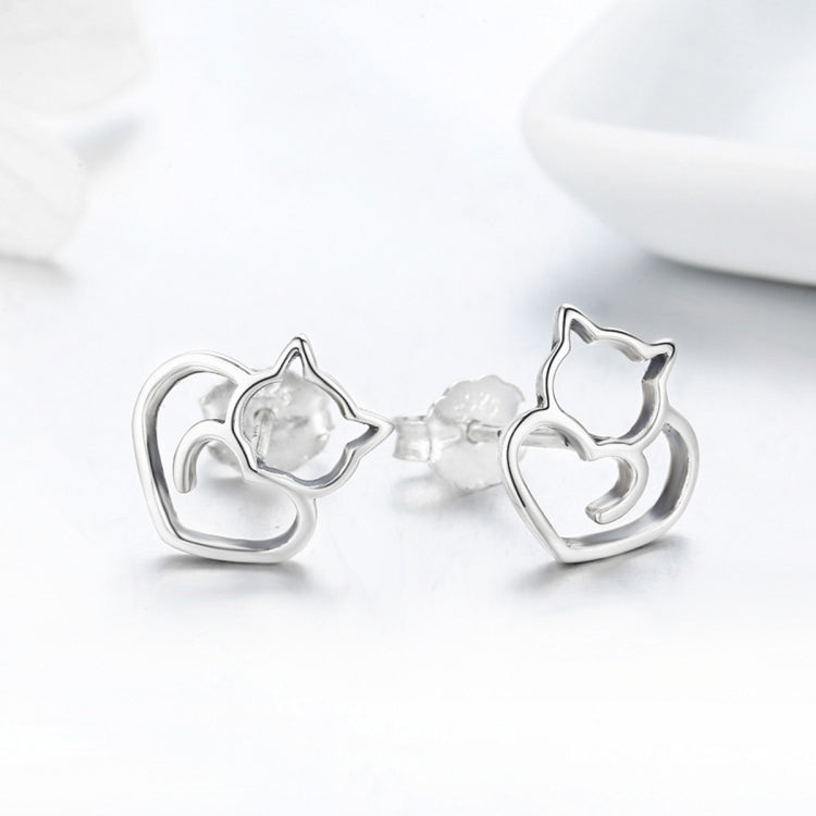 Sterling silver cat-heart stud earrings, side view showing hollow cat and heart shapes