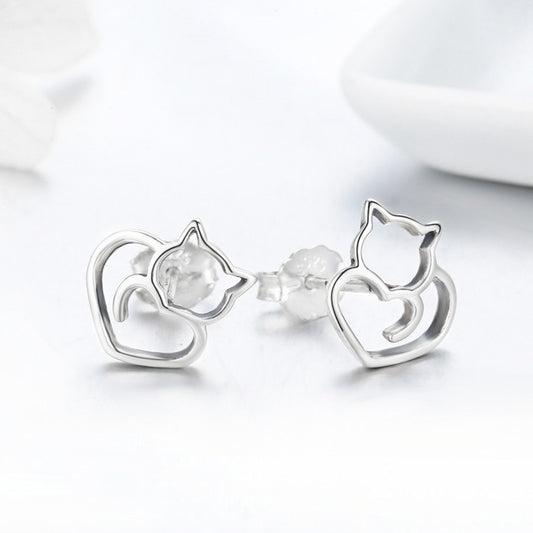 Sterling silver cat-heart stud earrings, side view showing hollow cat and heart shapes