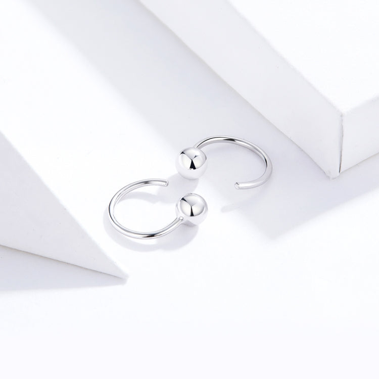 Pair of silver ball hoop earrings with small glossy spheres on the hoop wires