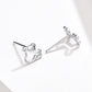 Sterling silver dog bone stud earrings with posts shown, angled view