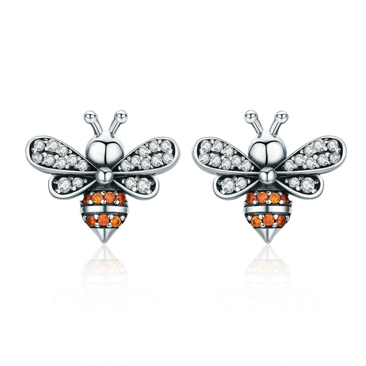 Bee stud earrings in sterling silver with white stones and orange accents