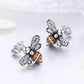 Bee stud earrings in sterling silver with clear and orange stone accents