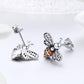 Sterling silver bee stud earrings with white and orange crystal inlay