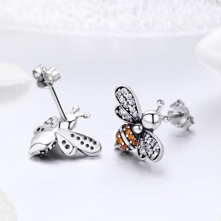 Sterling silver bee stud earrings with white and orange crystal inlay