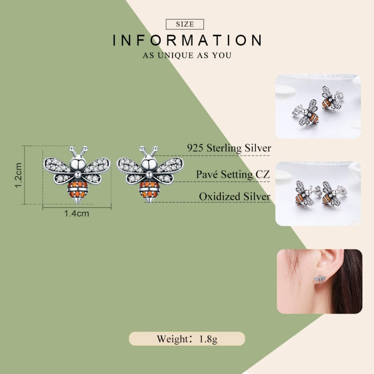 Sterling silver bee stud earrings with white stones and orange accents