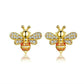 Bee stud earrings in gold tone with clear and orange inlaid stones, pair
