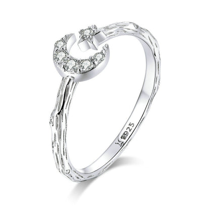 Sterling silver open ring with crescent moon, star, and clear zircon accents