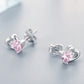 Pair of heart stud earrings with pink gemstones and sterling silver settings