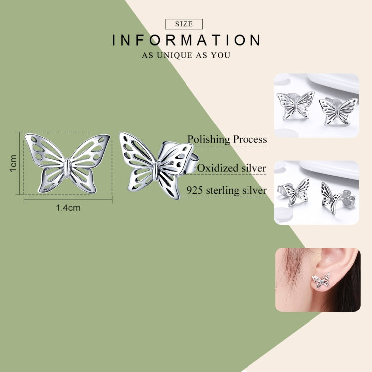 Sterling silver butterfly stud earrings with polished cutout wings and reflective finish