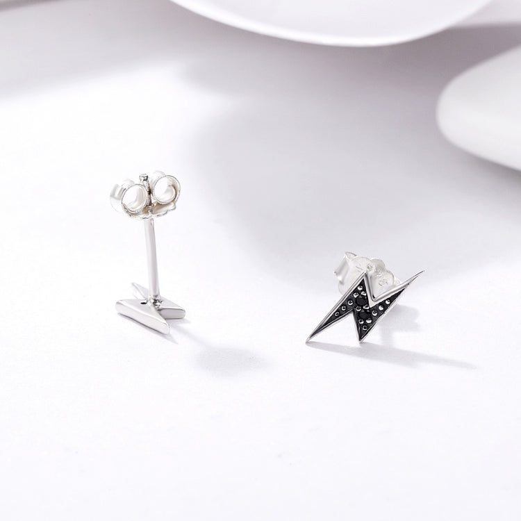 Lightning bolt stud earrings in sterling silver with black inlay, visible back posts