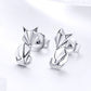 Sterling silver fox origami stud earrings, angled view, shiny mirror finish