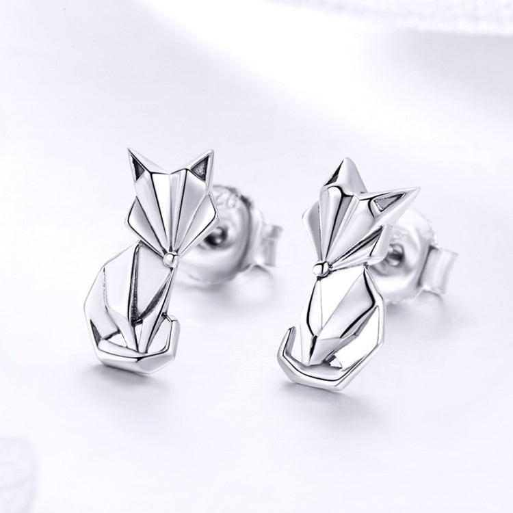 Sterling silver fox origami stud earrings, angled view, shiny mirror finish