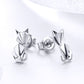 Sterling silver fox origami stud earrings with black enamel accents, front view