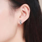 Sterling silver fox origami stud earrings on ear, geometric fox silhouette