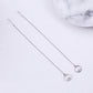 Sterling silver drop earrings with thin chains and small round crystal charms.