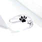 Sterling silver paw print open ring with black enamel pads and CZ charm