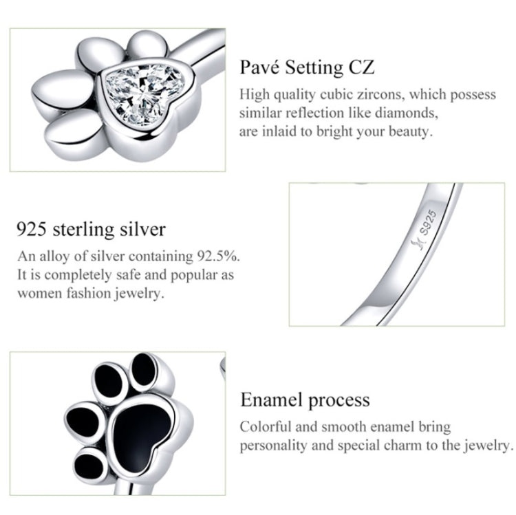 Sterling silver paw print open ring with black enamel detail and sparkling CZ