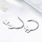 Pair of silver cat drop earrings with curved hooks and cat face silhouette