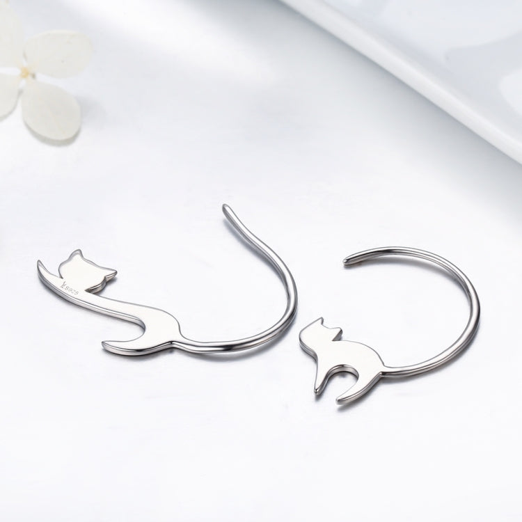 Pair of silver cat drop earrings with curved hooks and cat face silhouette