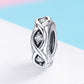 Sterling silver zircon bead charm with oval frame and three clear cubic stones