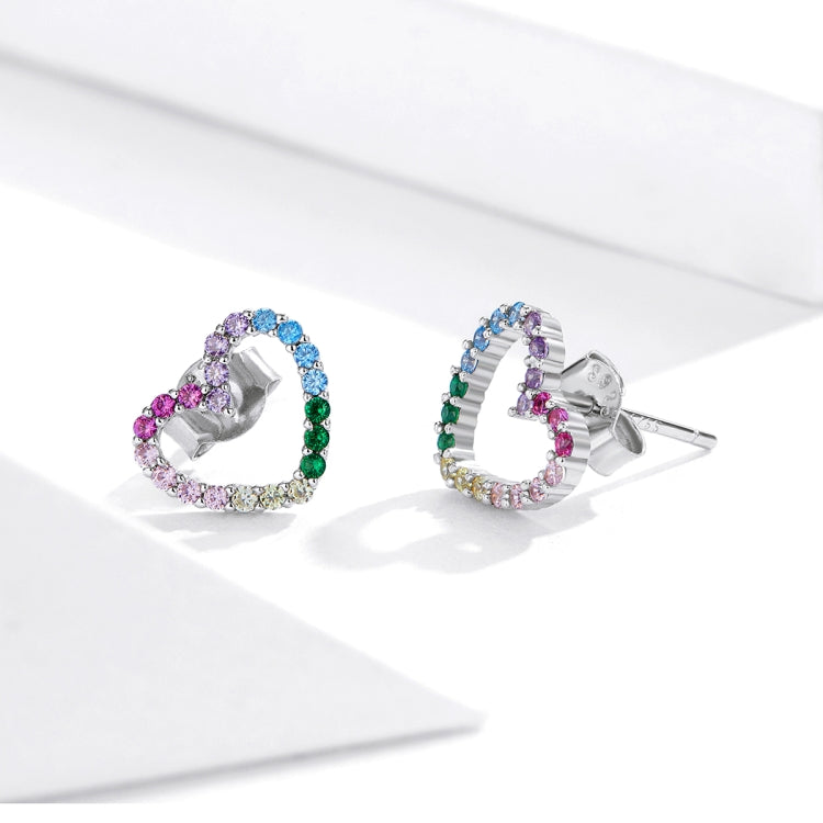 Rainbow heart-shaped CZ stud earrings with silver posts and multicolored stone border