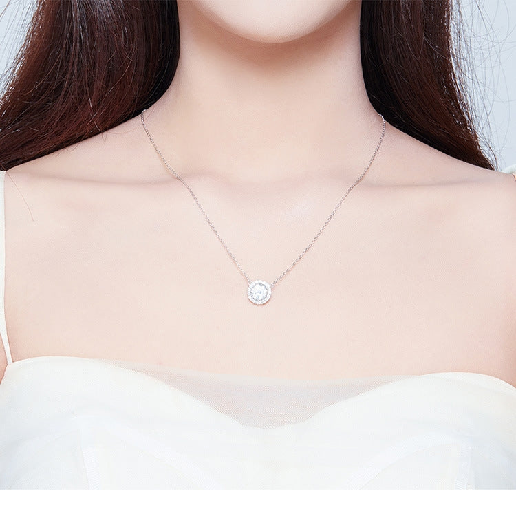 Silver zircon pendant necklace worn on chest, round halo center stone pendant