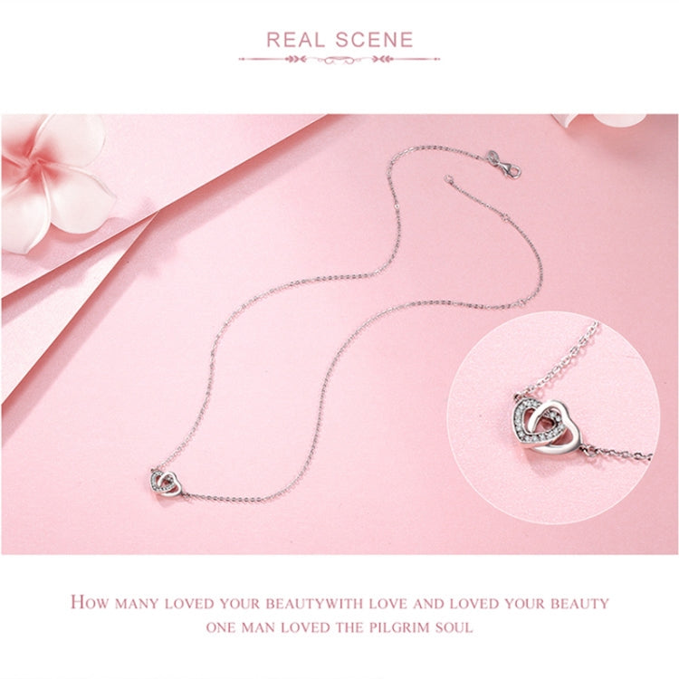 Sterling silver heart pendant necklace on a fine chain with CZ stones